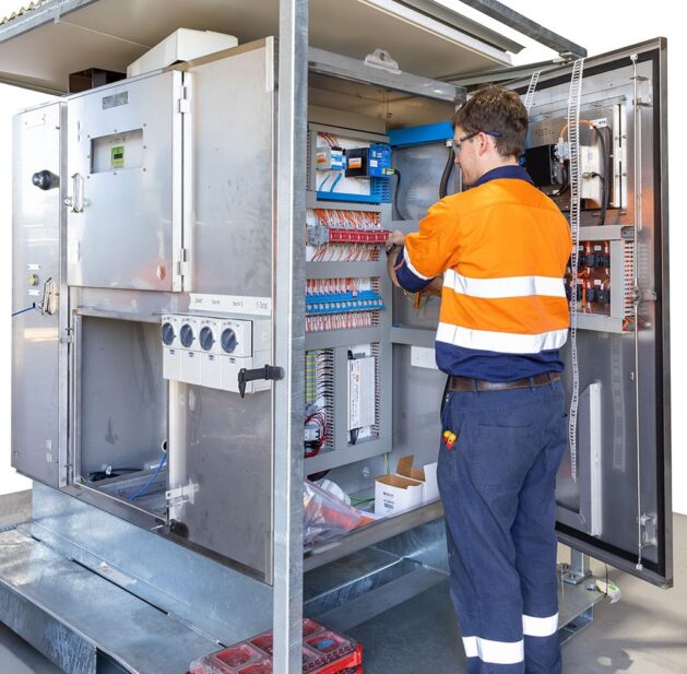  Electrical Engineer working on the electrical distribution board at Milek Engineering